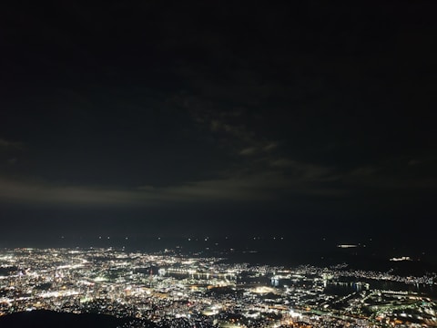 A glowing neural network pattern overlaying a cityscape at night.