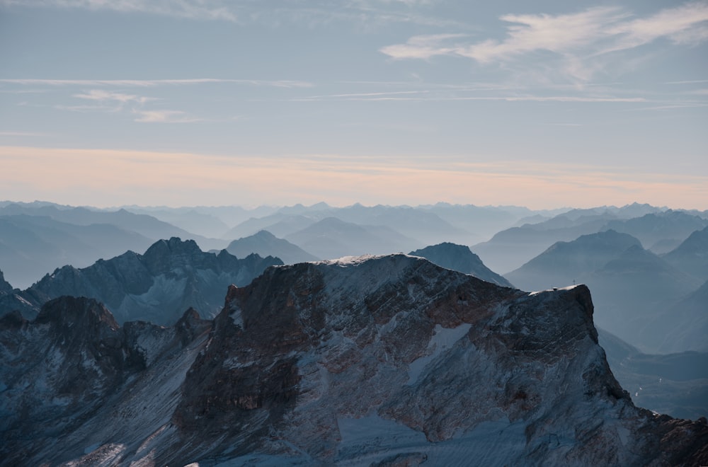 a view of a mountain range from the top of a mountain