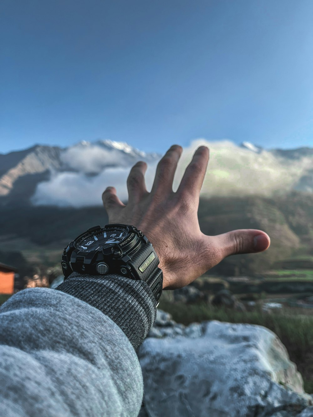 a person's hand with a watch on it