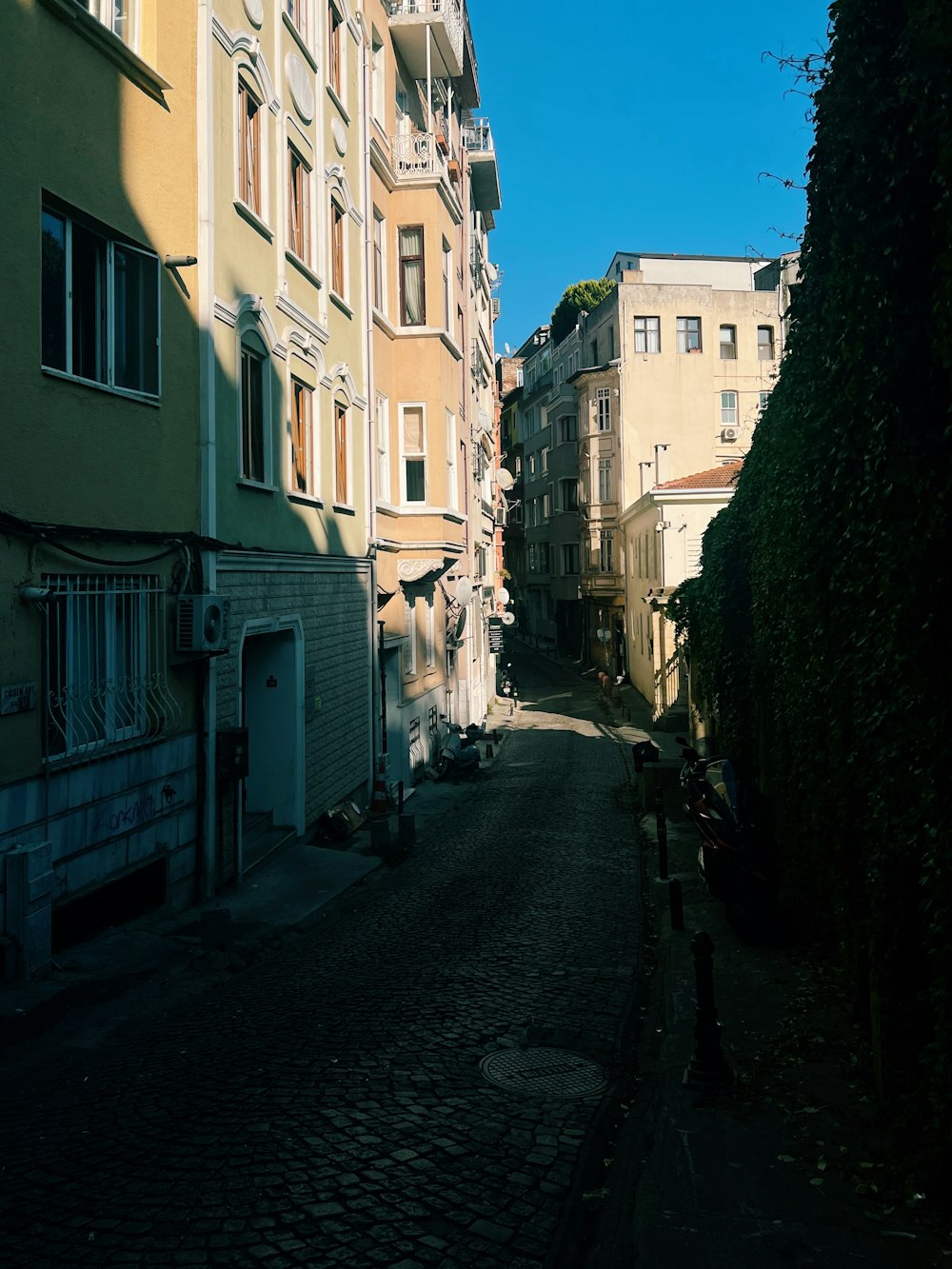 a narrow street with buildings on both sides