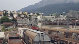 Railway wagons filled with bauxite at a loading station.