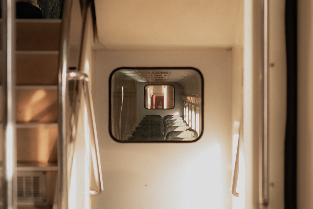 a view of a stairway through a mirror