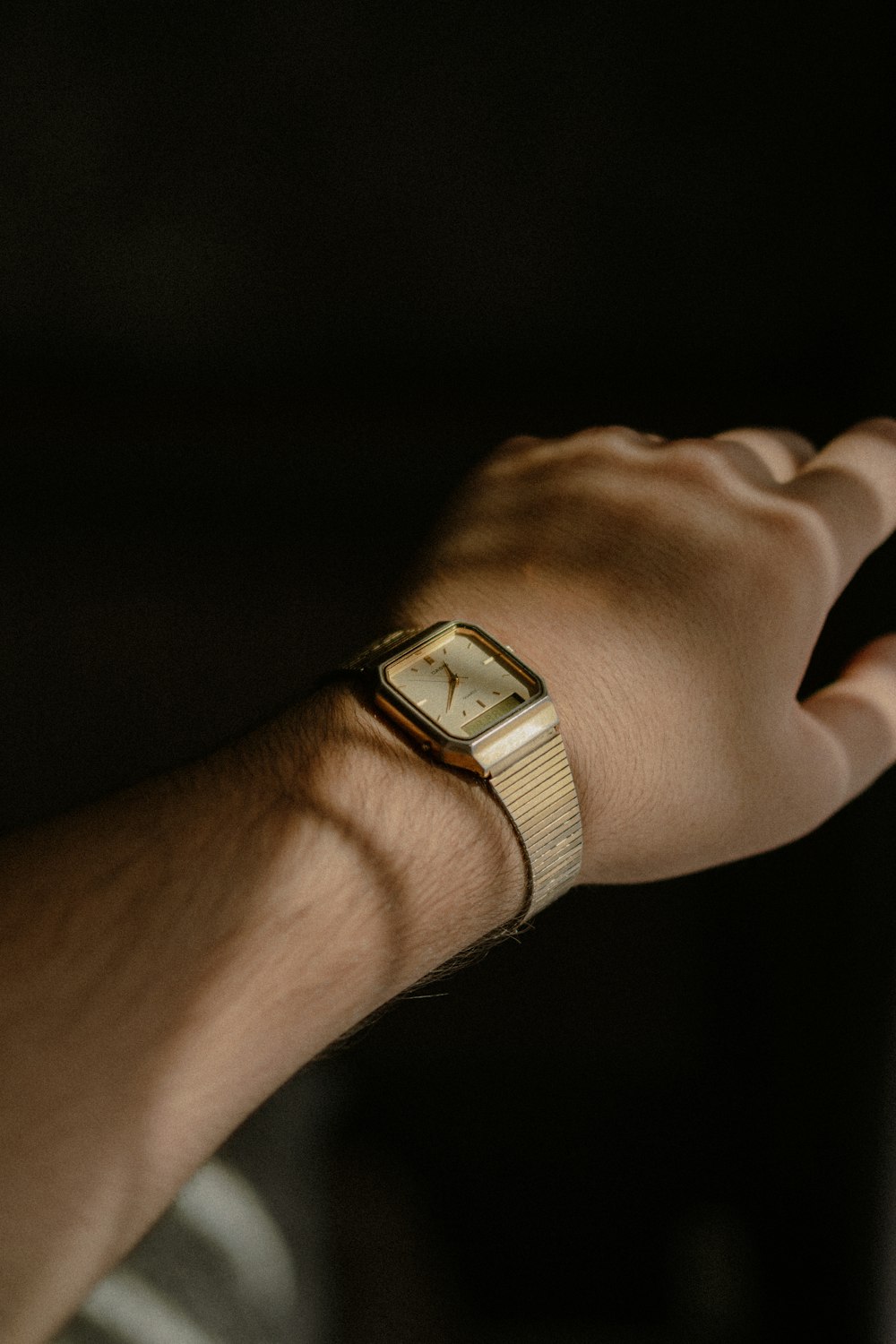 a person's hand with a watch on it