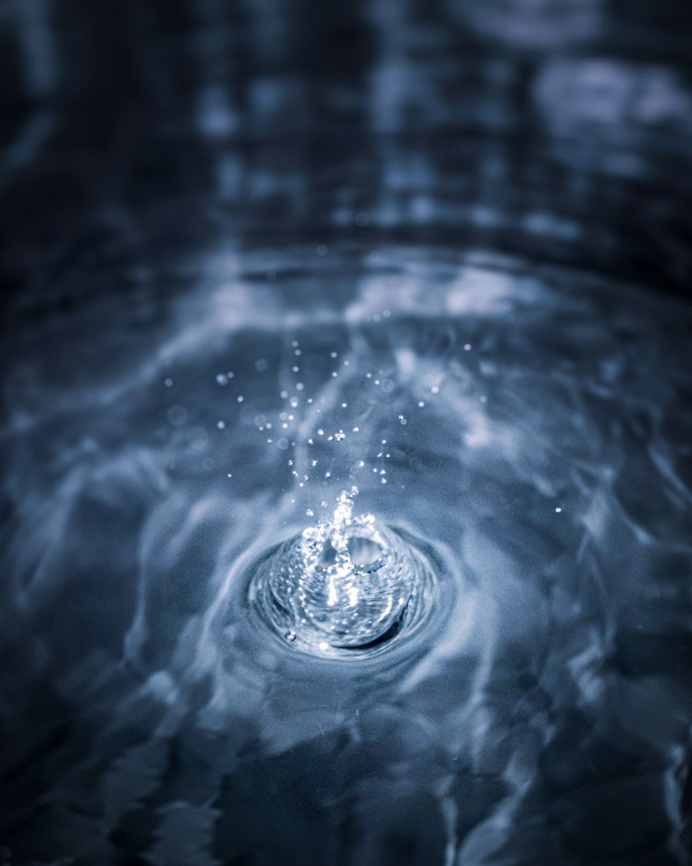 a close up of a water drop in a sink