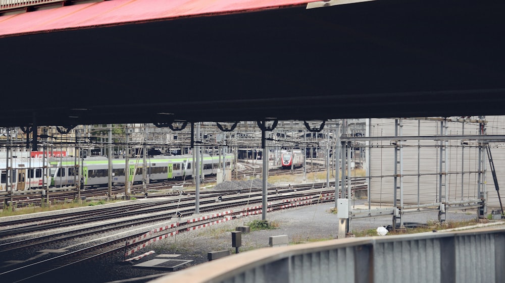 a train traveling down tracks next to a train station