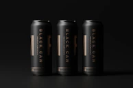 Overhead shot of three Divorox cans arranged in a triangle on a black surface with teal highlights.