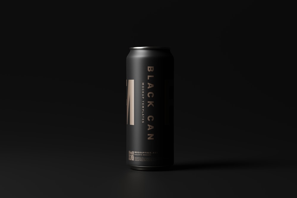a black can of beer on a black background