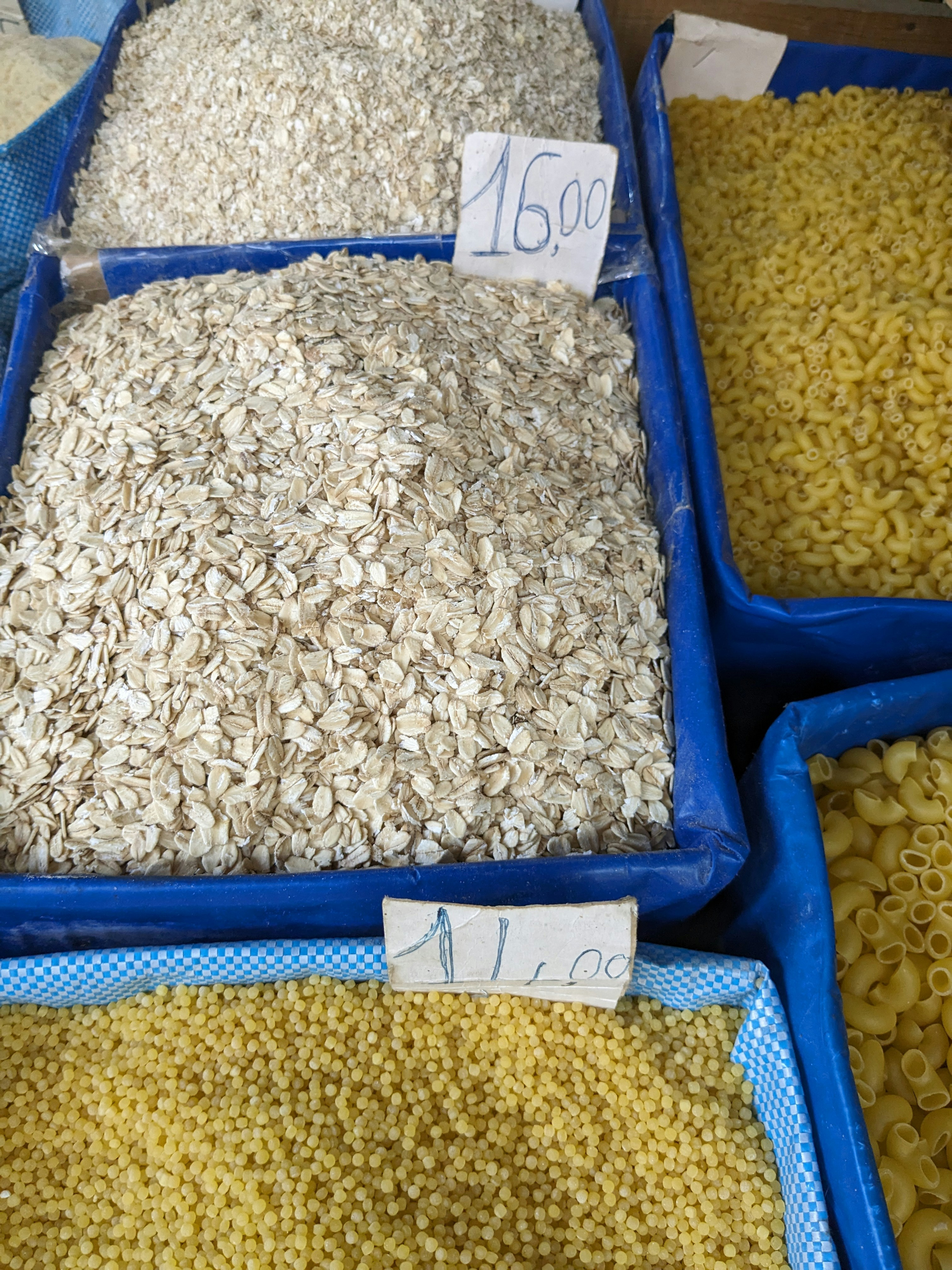 Golden basmati rice grains in burlap sacks and bowls, warm natural lighting, rustic food styling