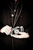 Portrait of an elderly hands holding a vintage camera, telling a story of time and passion.