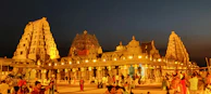 The majestic Jagannath Temple in Puri with its towering spires and vibrant crowds during festival time.