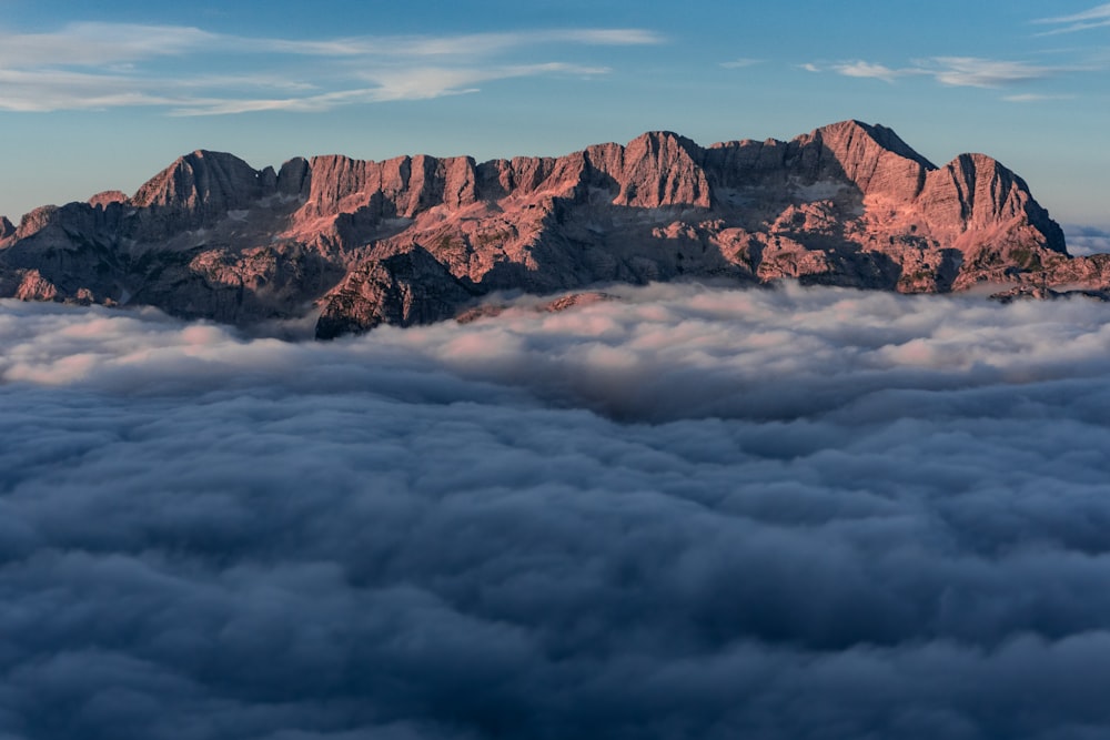 a view of a mountain range from above the clouds