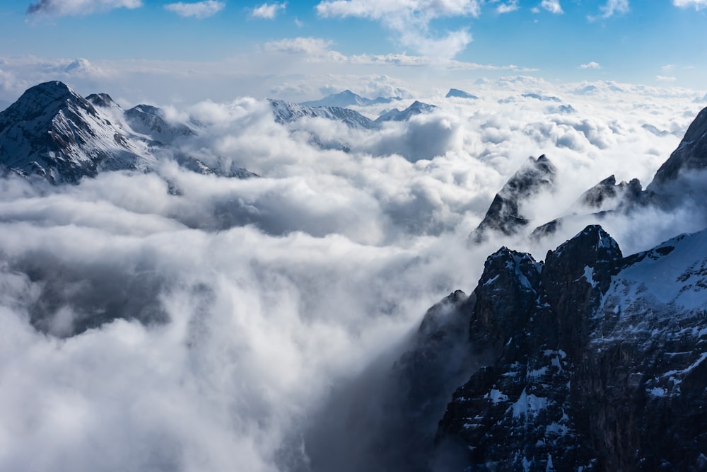 a view of a mountain range covered in clouds