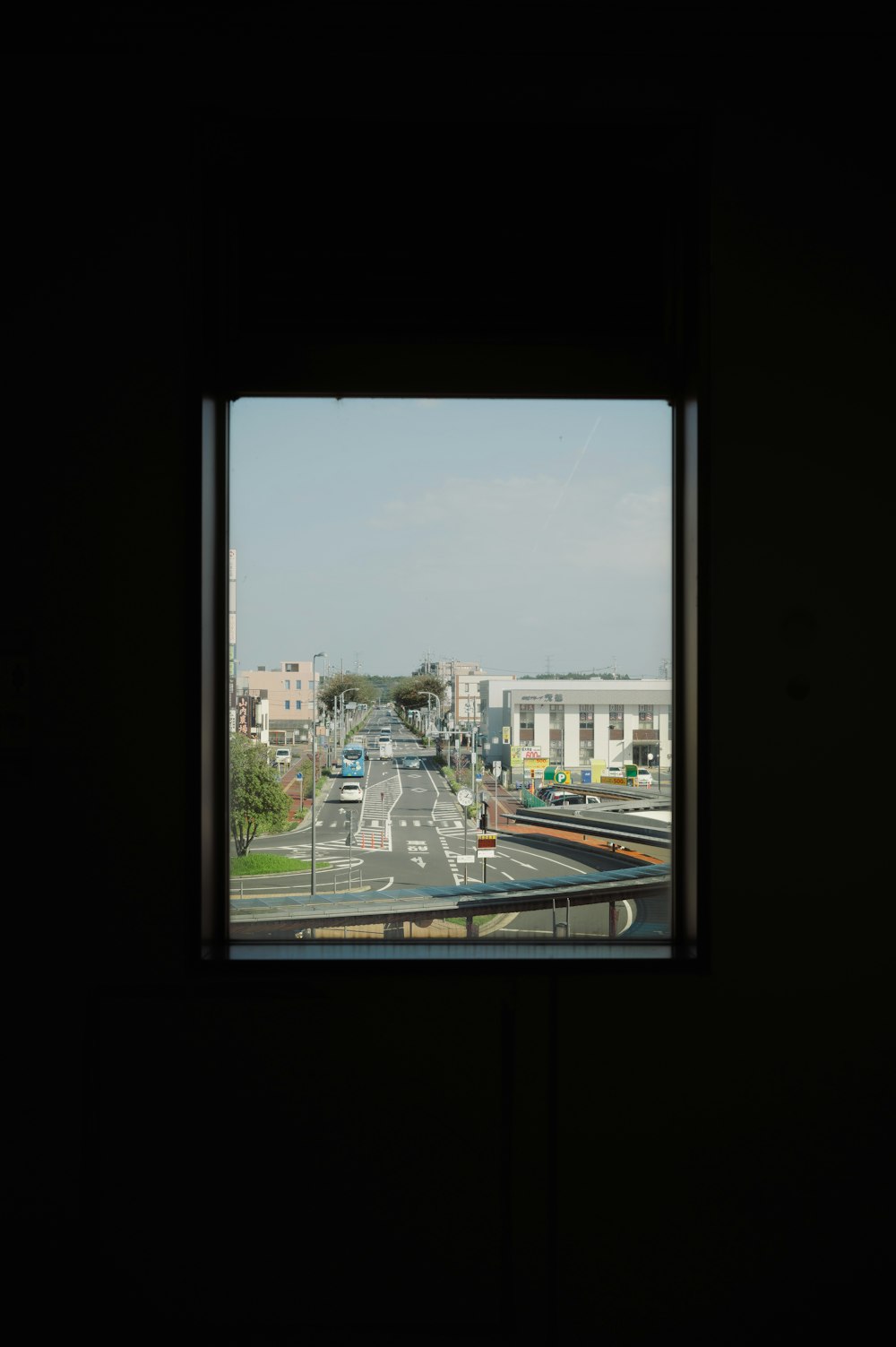 a view of a street from a window in a building