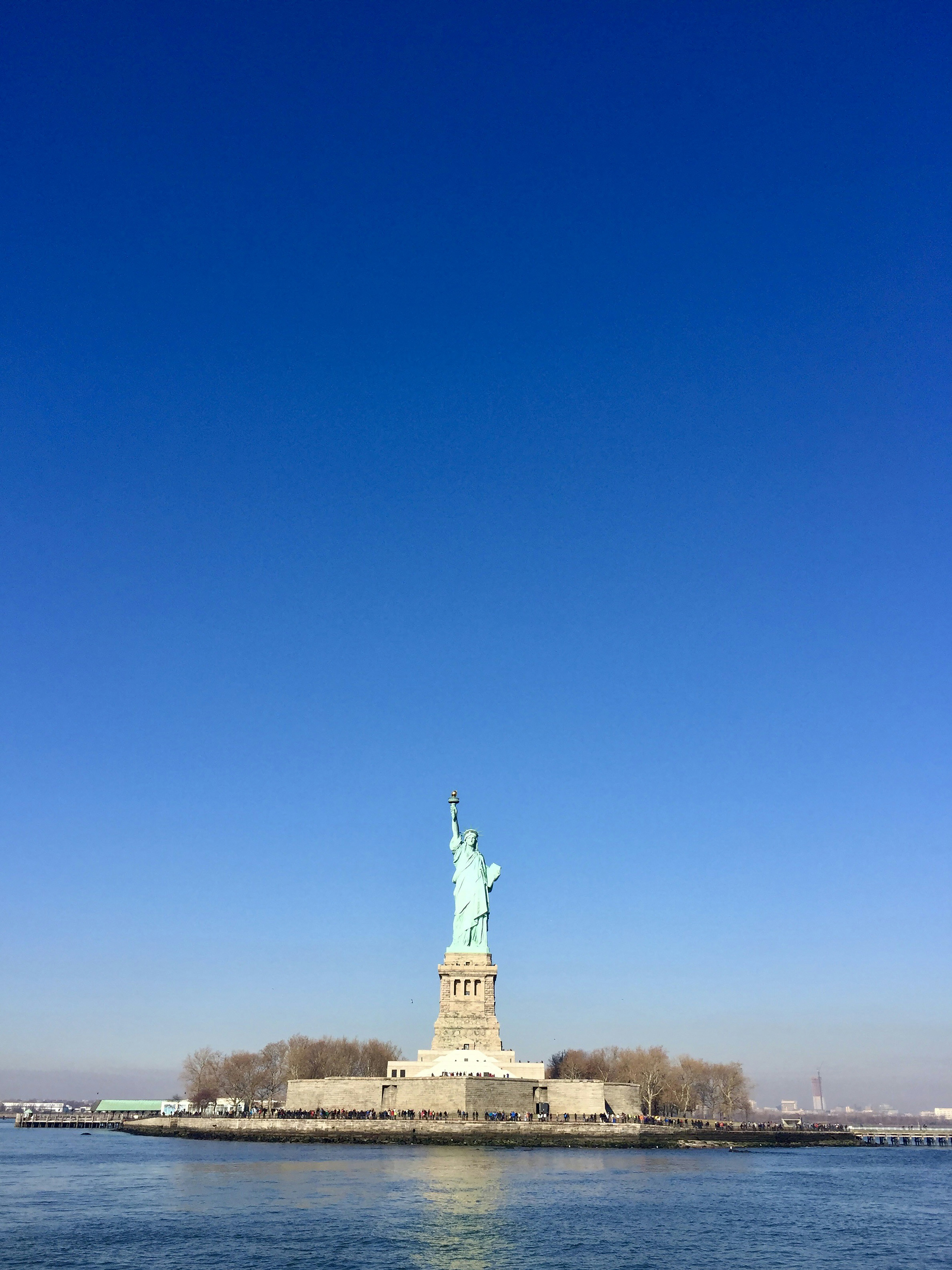 the statue of liberty is in the middle of the water