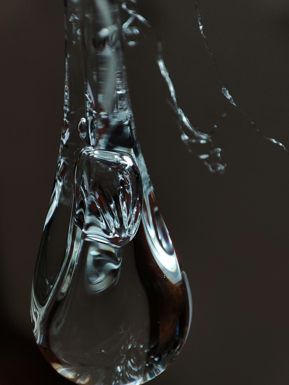 a drop of water falling from a faucet