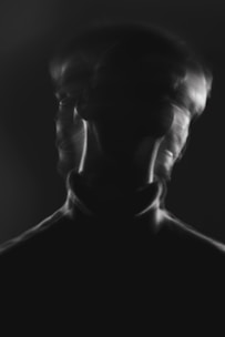 a blurry image of a man's face and neck