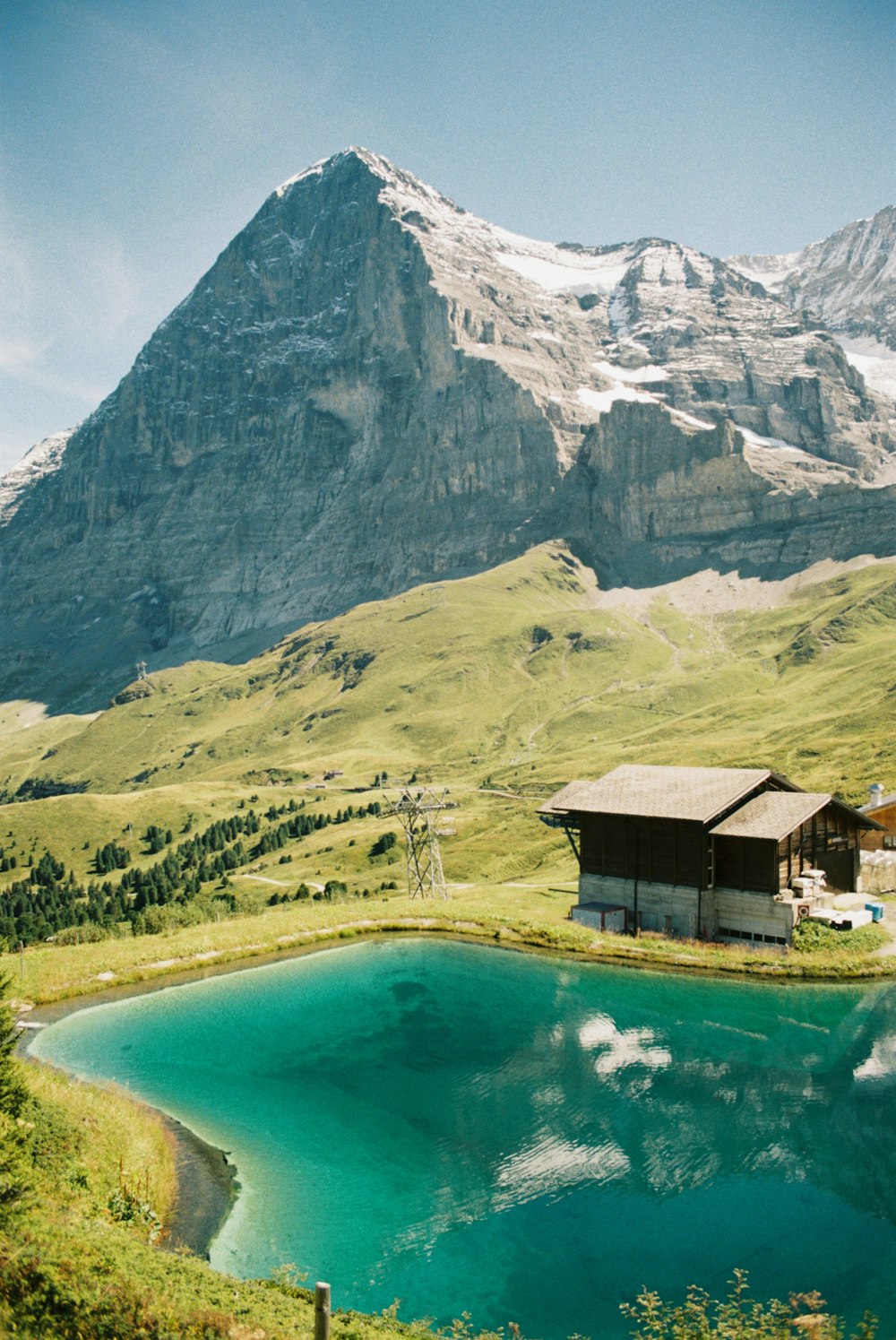 a mountain range with a lake in the foreground