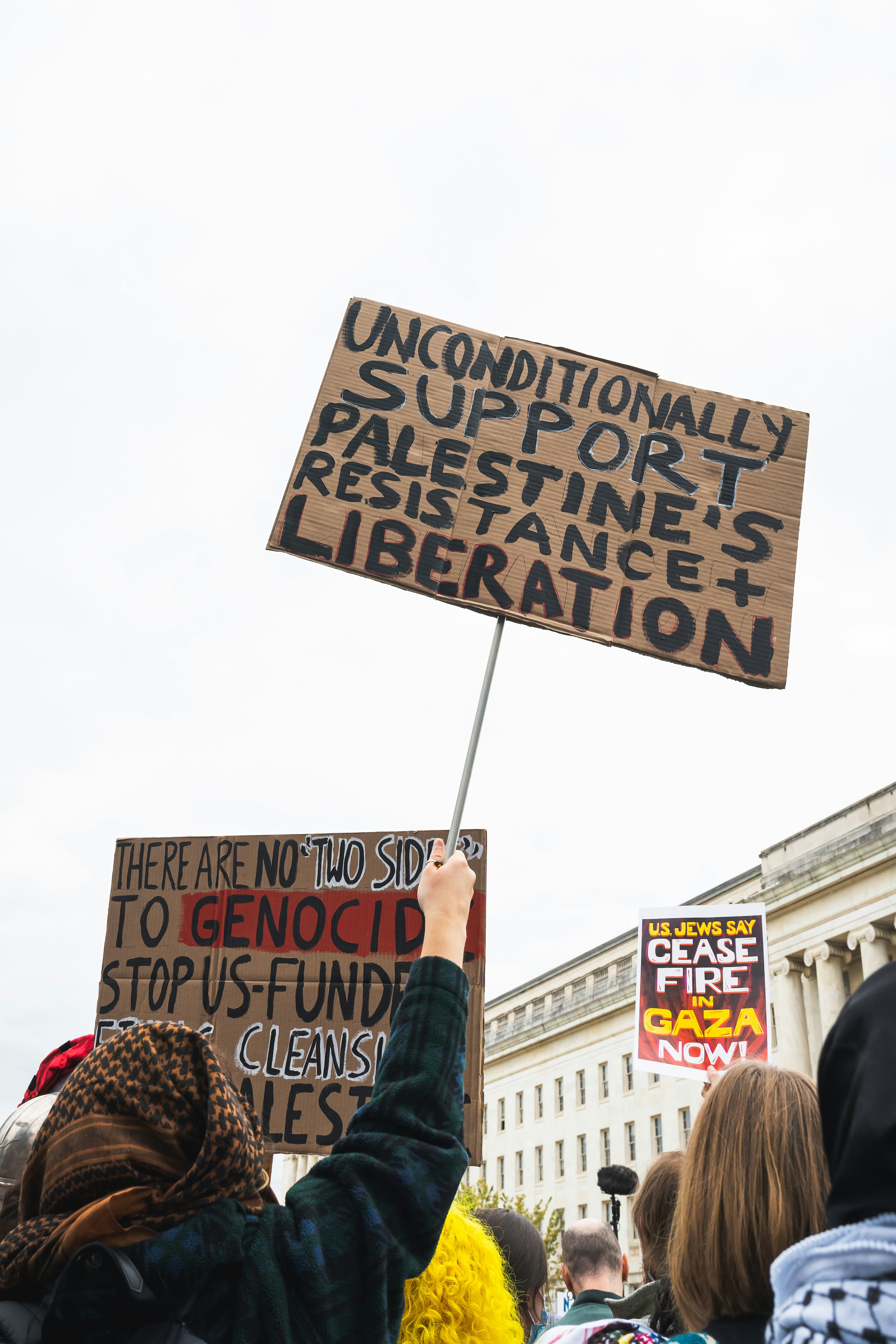a group of people holding up protest signs