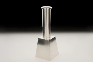 A sleek candlestick chart with gold and emerald highlights on a deep navy background