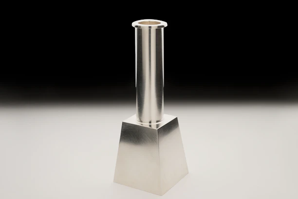 Minimalist candlestick chart with emerald green highlights on a deep navy background.