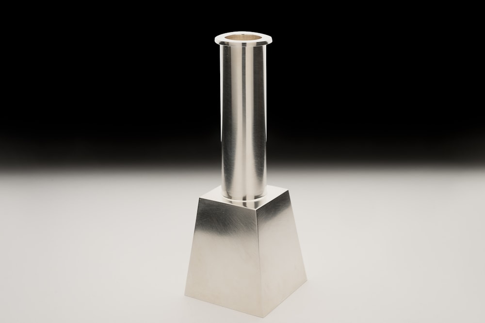 a tall metal object sitting on top of a table