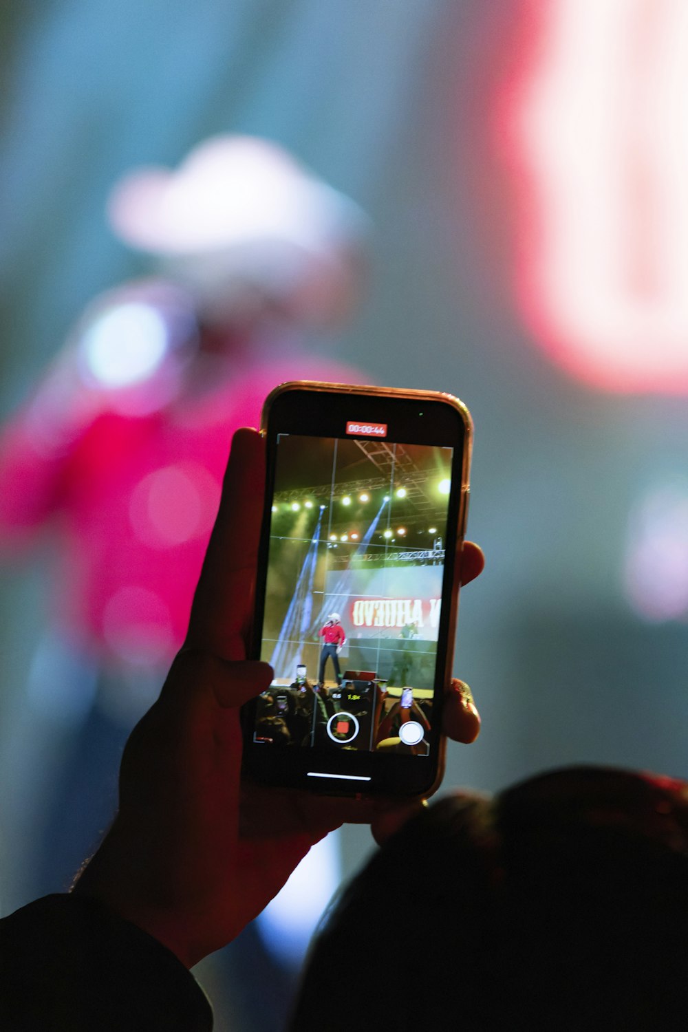 a person taking a picture with a cell phone