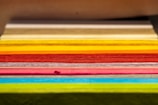 A close-up of colorful printed materials stacked neatly.
