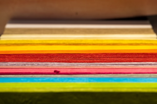 A close-up of colorful printed materials stacked neatly.