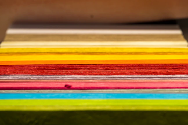 Stacks of printed documents demonstrating cost-effective printing solutions.