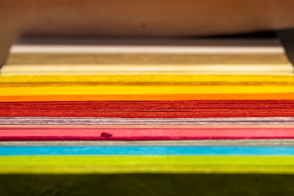 A close-up of colorful printed packaging films stacked neatly.