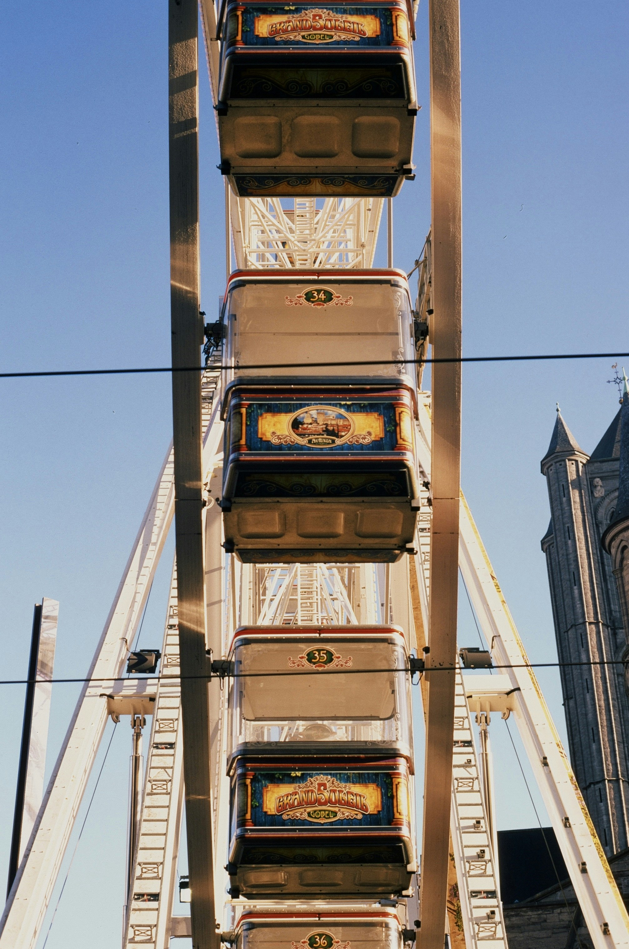 a ferris wheel with six boxes on top of it