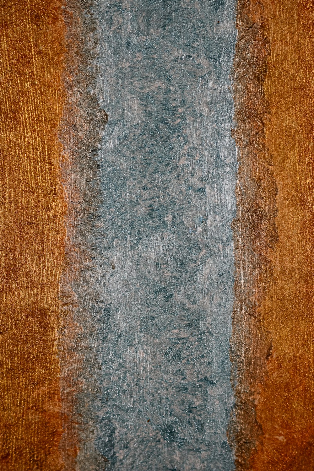 a brown and blue wall with a blue stripe on it