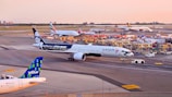a large jetliner sitting on top of an airport tarmac