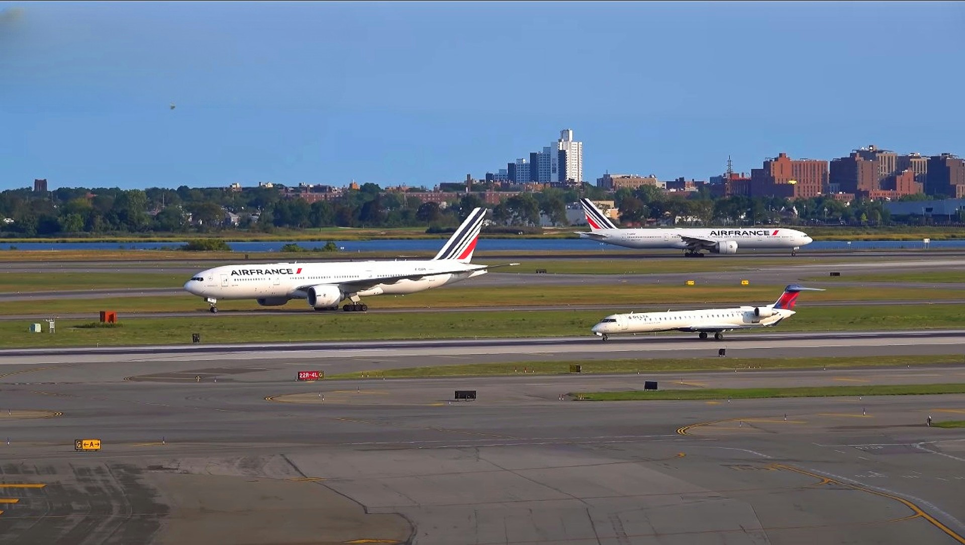 woman wearing yellow long-sleeved dress under white clouds and blue sky during daytime
