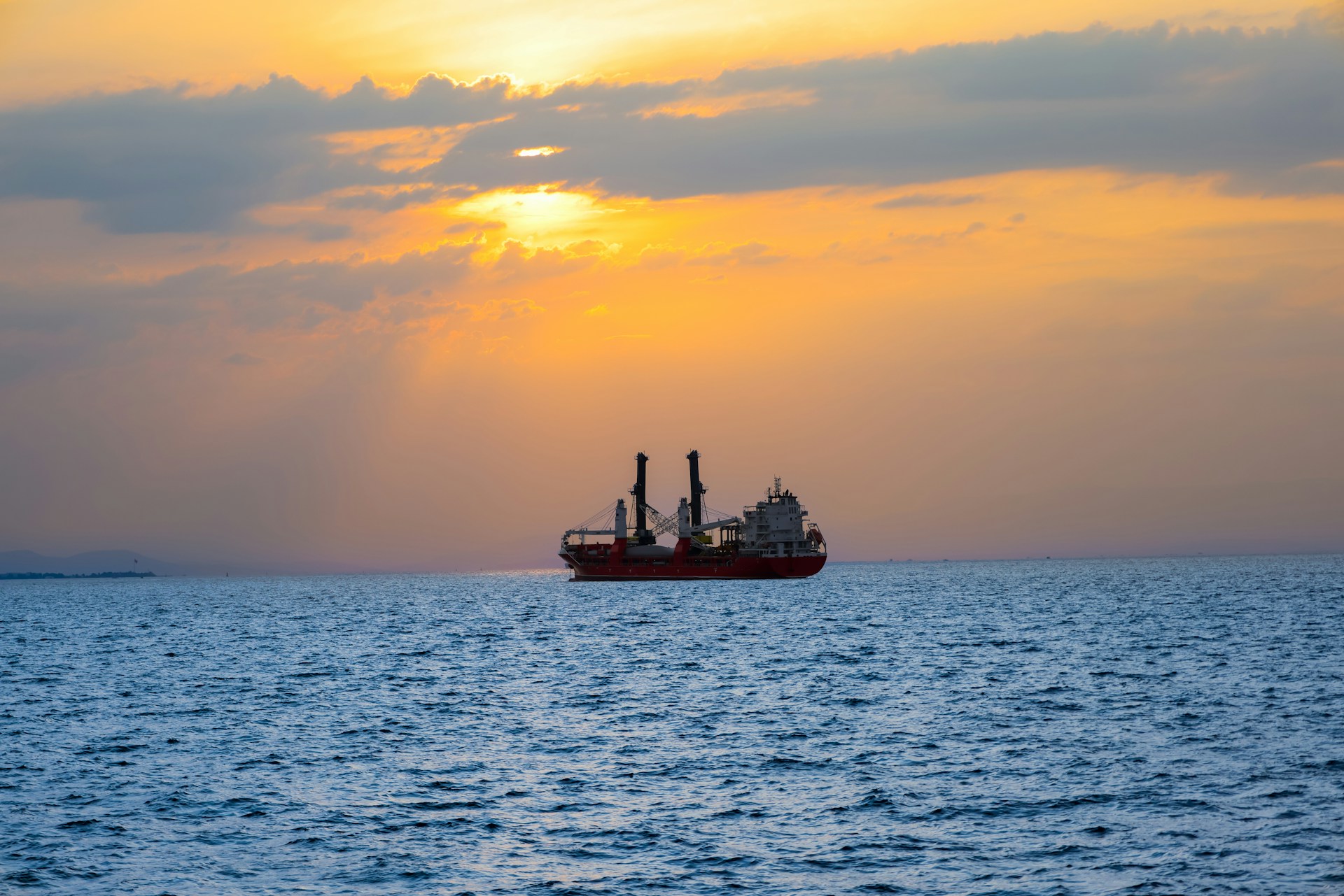 woman wearing yellow long-sleeved dress under white clouds and blue sky during daytime