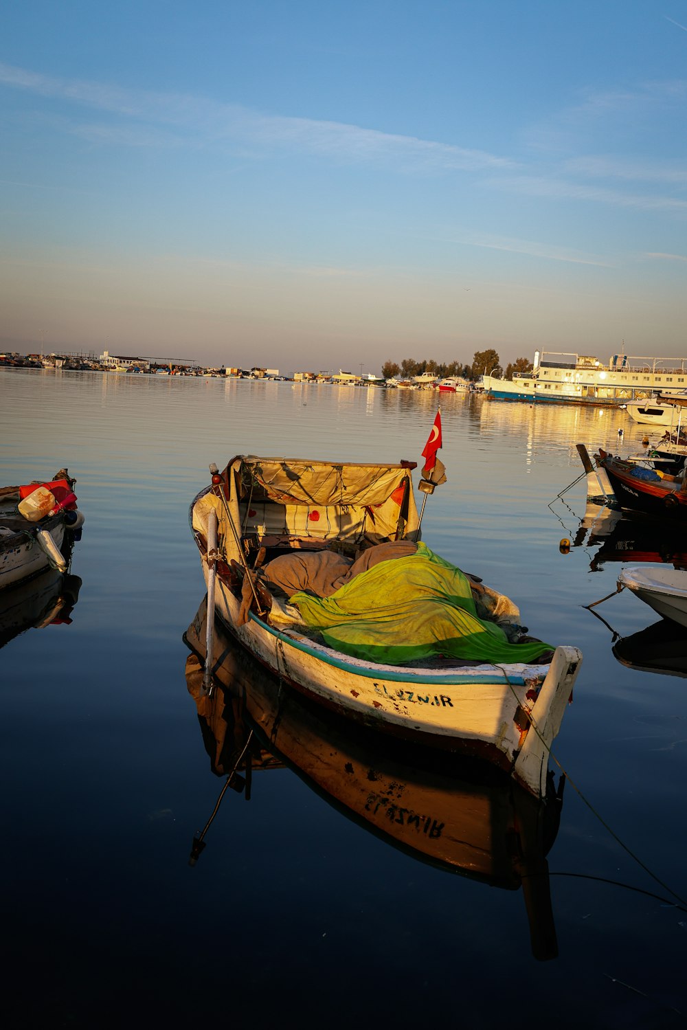 a group of boats floating on top of a body of water