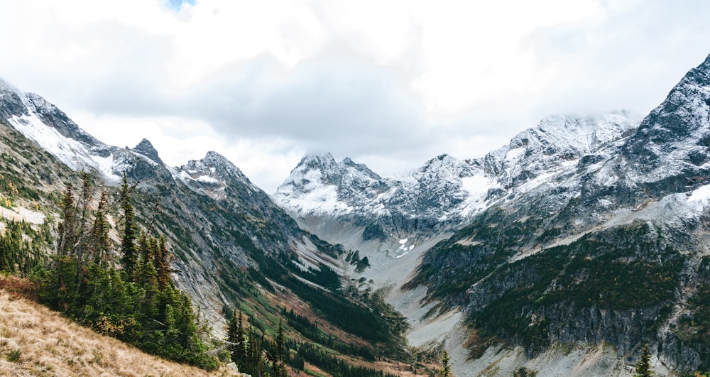 a view of a mountain range from a trail