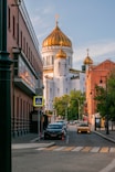 a city street with a church in the background