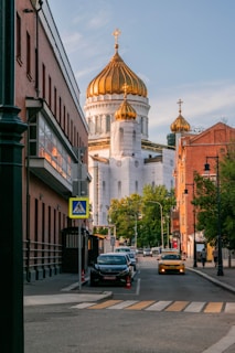 a city street with a church in the background