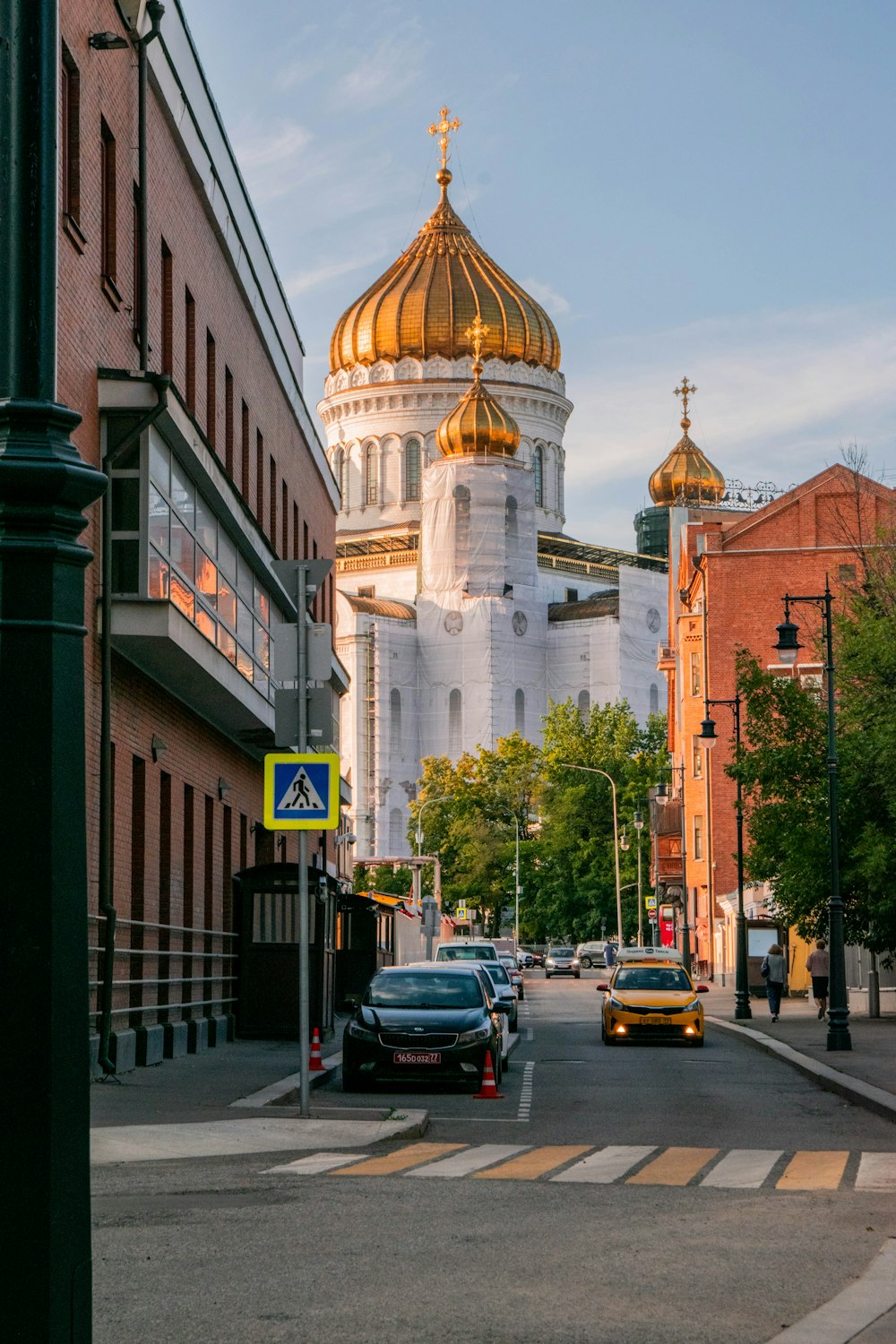 a city street with a church in the background