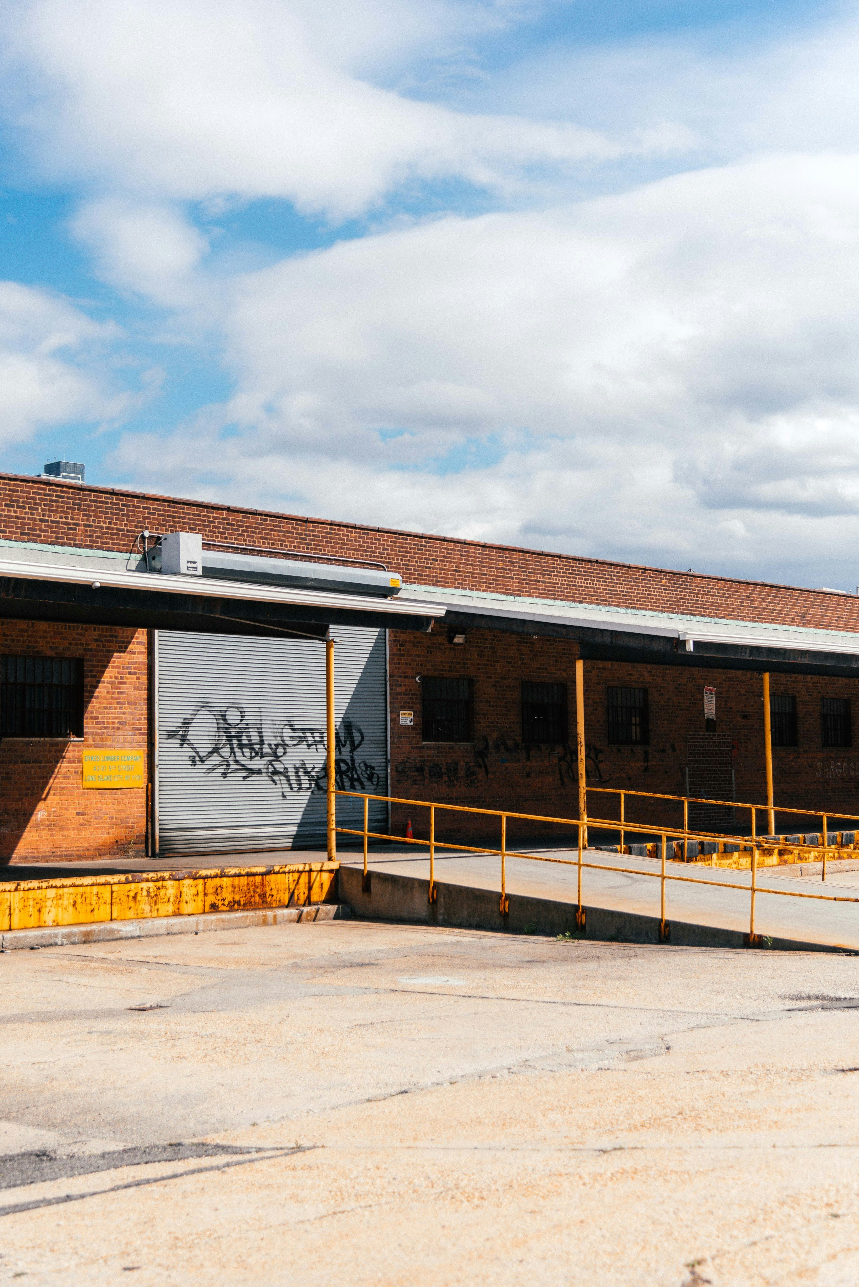 a train station with graffiti on the side of it