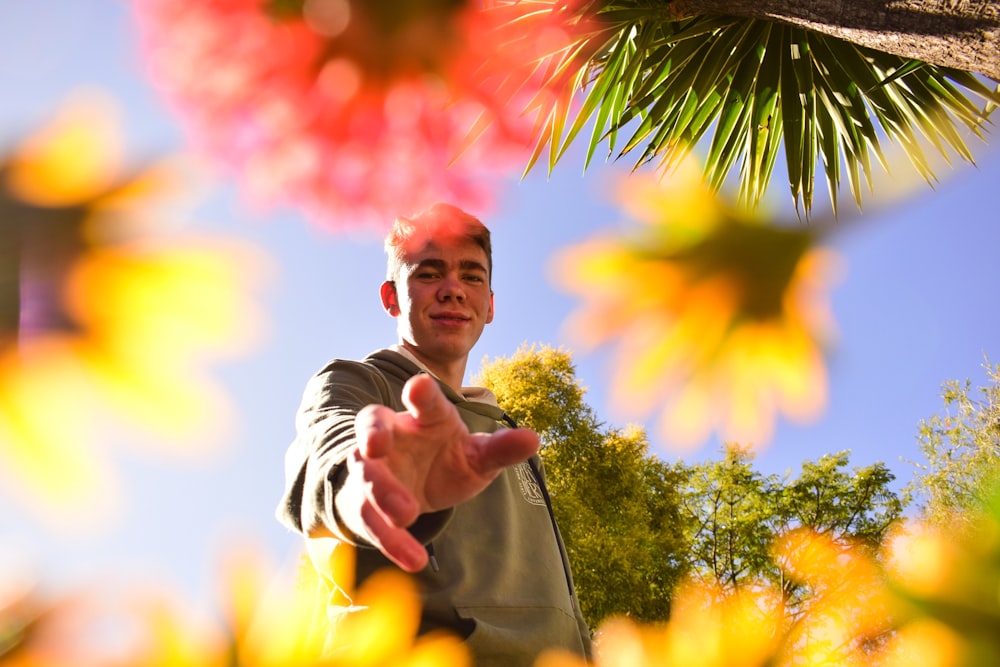 a man pointing at something in the air