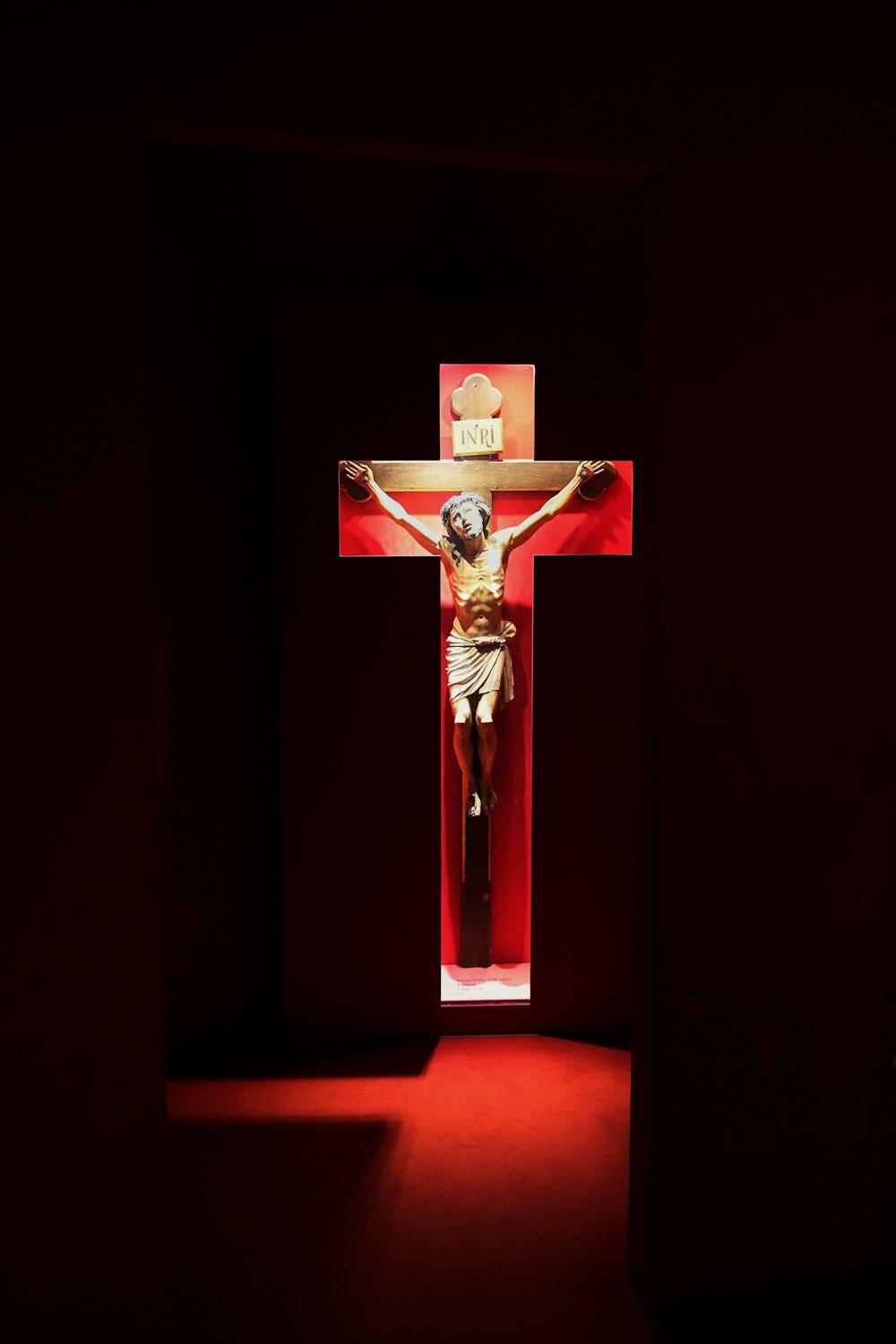 a crucifix in a dimly lit room