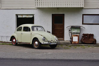 A cozy workspace with a vintage Volkswagen Beetle poster on the wall.