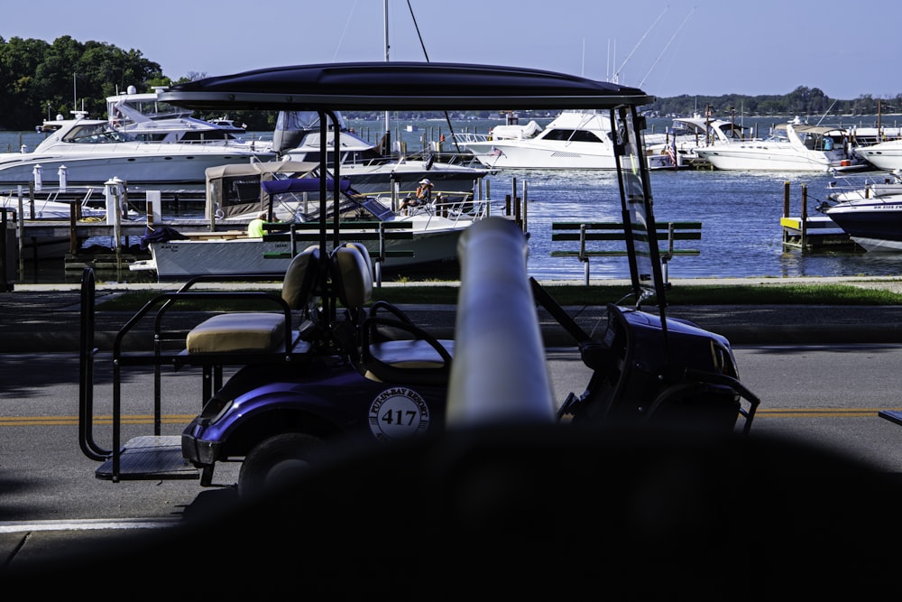 a golf cart parked in front of a marina