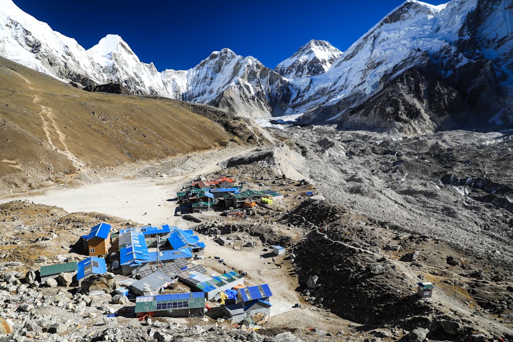 a group of tents set up in the mountains