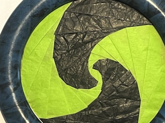 Recycled materials arranged in a circular pattern symbolizing resource renewal.