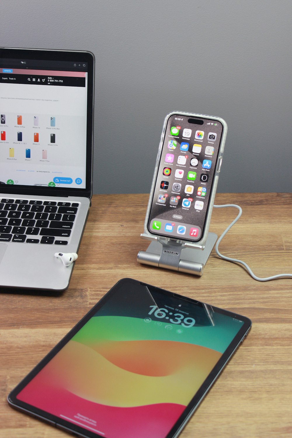 a cell phone and a laptop on a table