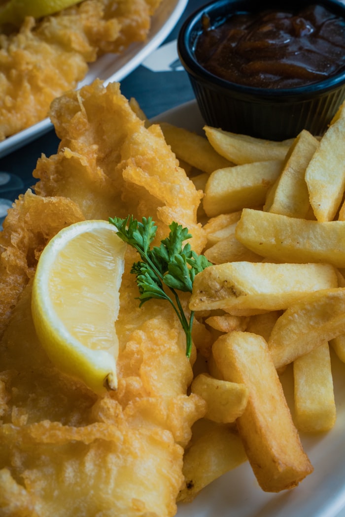 Crispy battered fish and chips with lemon