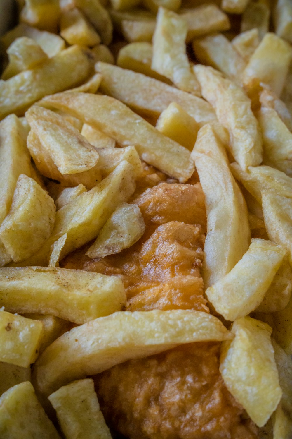 a close up of a pile of fried food